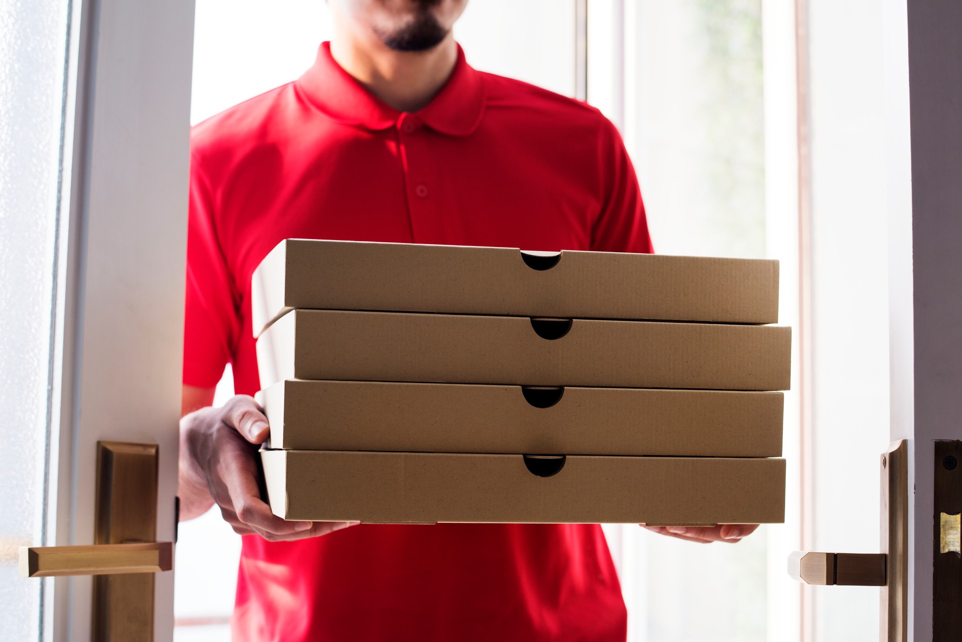 Man delivery pizza to customer